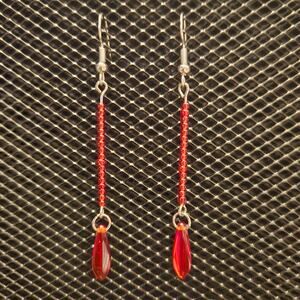 Light red seed bead and dagger bead dangle earrings